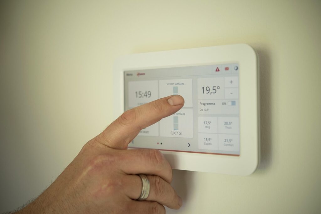 White wall-mounted smart home controller tablet used to manage smart home technology